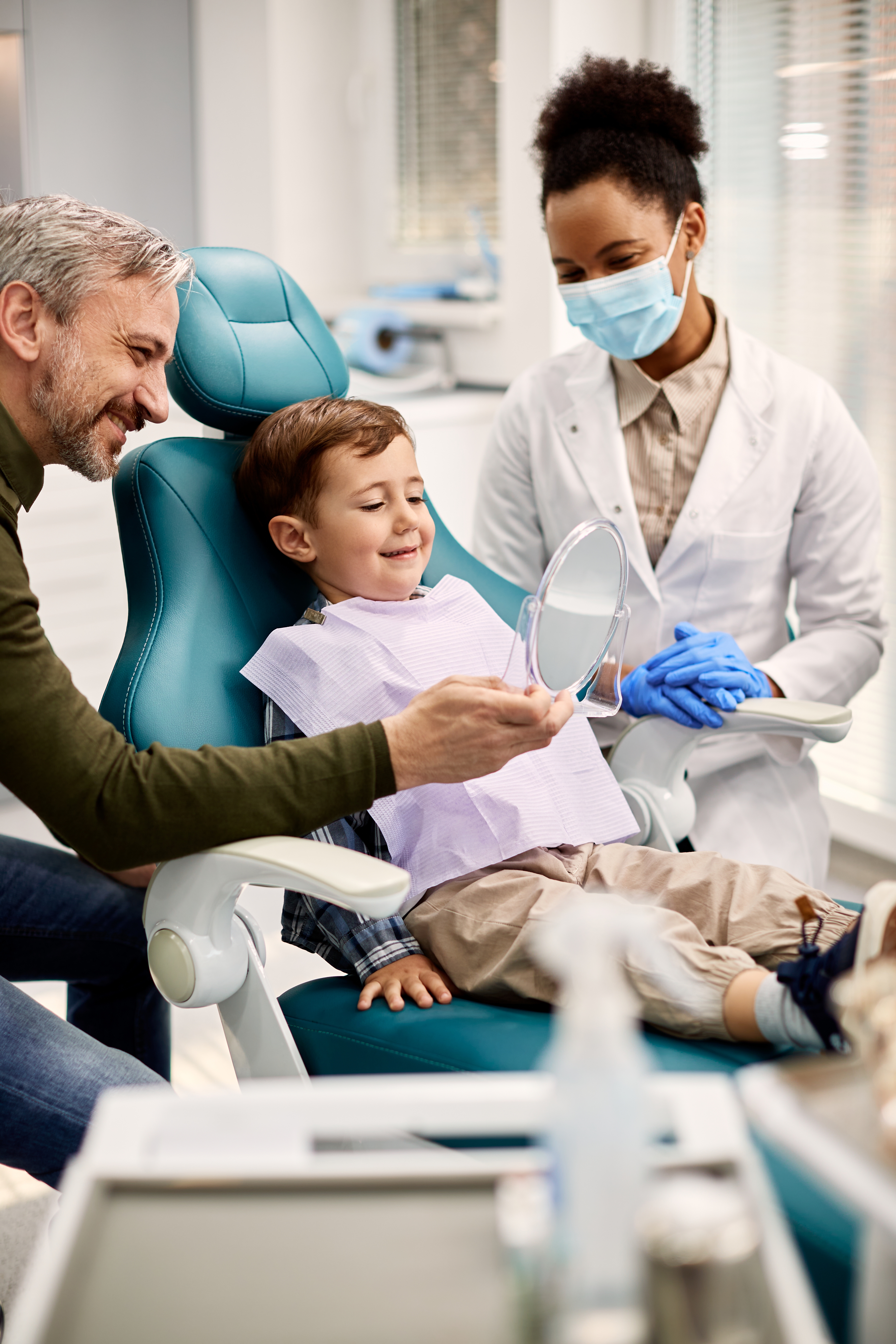 Happy,Little,Boy,Looking,His,Teeth,In,A,Mirror,While Bookkeeping for Dental Clinics